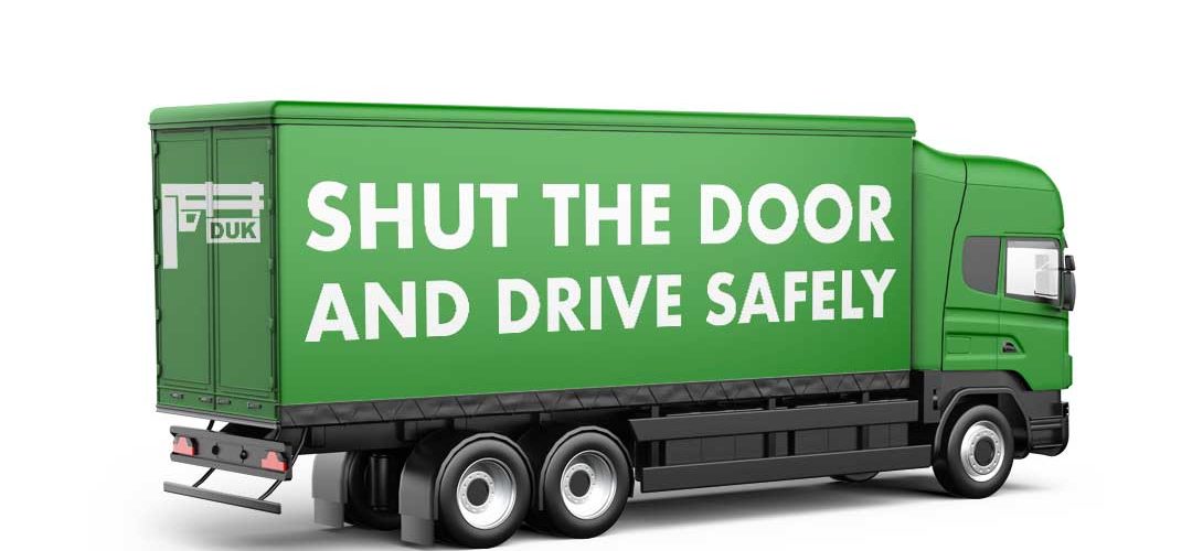 LKW mit shut the door and drive safely schriftzug